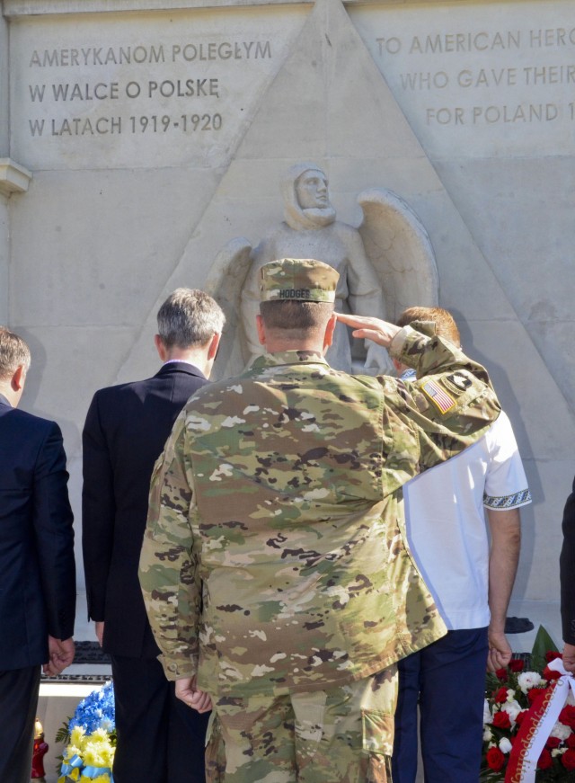 Lt. Gen. Hodges salutes at the memorial of three U.S. Airmen