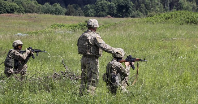A 3-15 Soldier provides feedback to Ukrainian Soldiers
