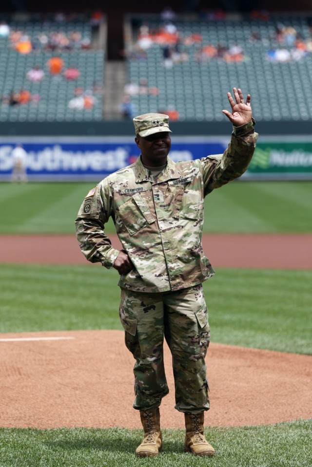 Senior Commander throws first pitch to honor APG