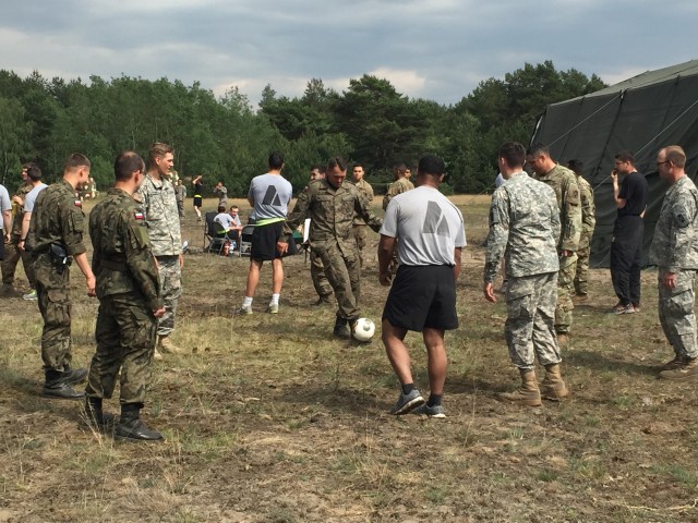 Friendly conversation while playing with a soccer ball