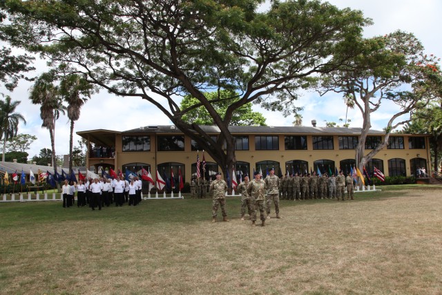Soldiers and civilians assigned to U.S. Army Health Clinic - Schofield Barracks share the field during the change of command ceremony on June 23, 2016.