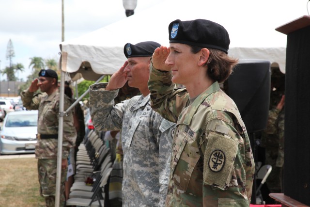 Soldiers and civilians assigned to U.S. Army Health Clinic - Schofield Barracks share the field during the change of command ceremony on June 23, 2016.