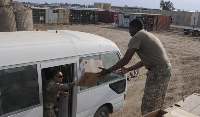 Soldiers in Iraq prepare ITEF supplies for distribution