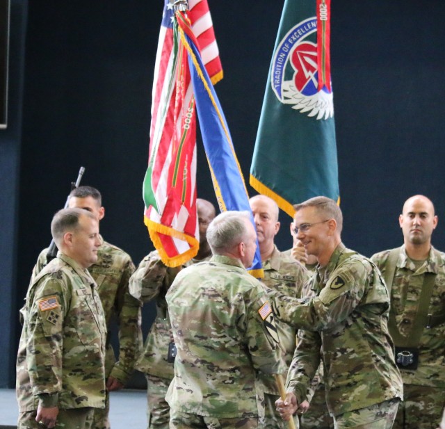OUTGOING COMMANDER PASSES GUIDON