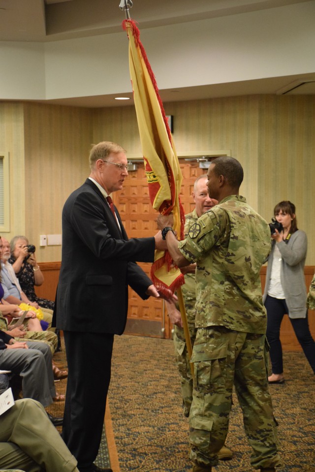 The guidon is passed as Fort Riley garrison commander Col. Andrew Cole Jr. departs