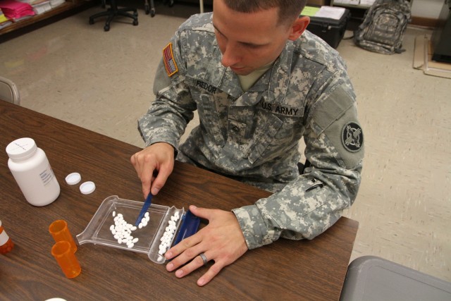 Pharmacy technician fills prescriptions during Greater Chenango Cares IRT