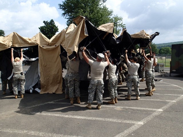 Service members prepare tents for IRT event in Norwich, NY.