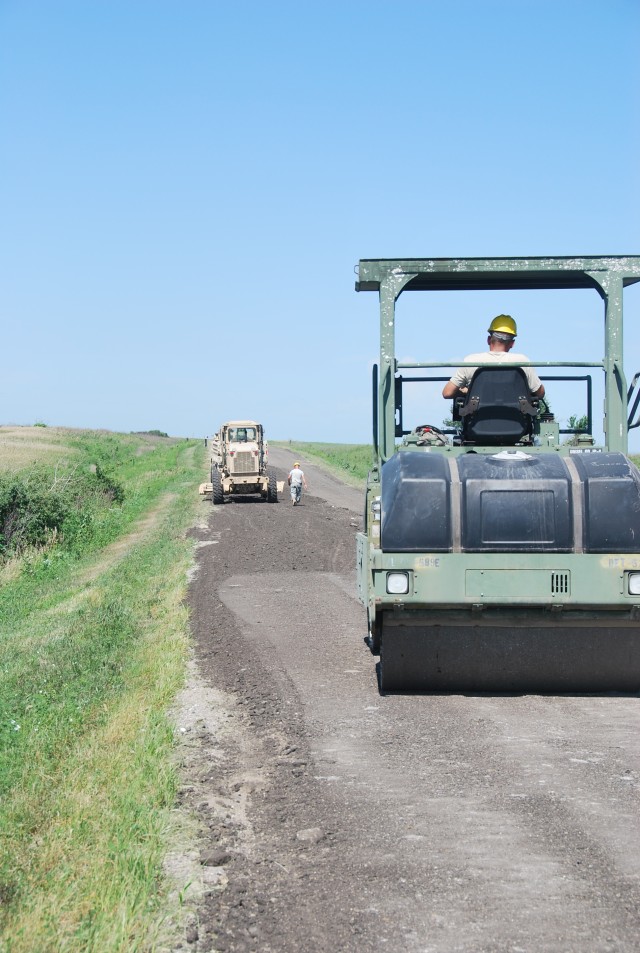 Illinois National Guardsmen fix road at Fort Riley's Douthit Gunnery Complex