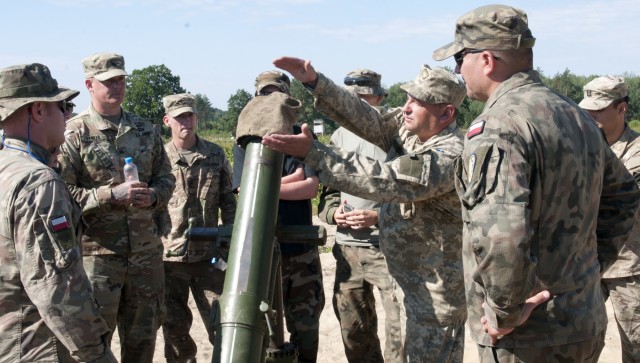 Ukrainian Soldiers mount the mortar