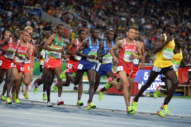 Spcs. Leonard Korir and Shadrack Kipchirchir run 10,000 meters