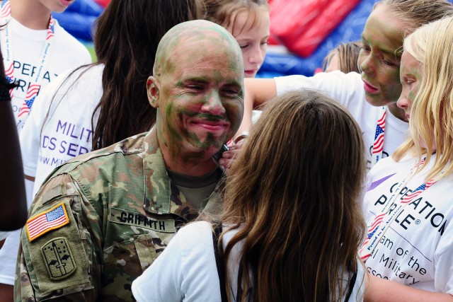 Soldiers, Army civilians break battle rhythm to support camp for military kids