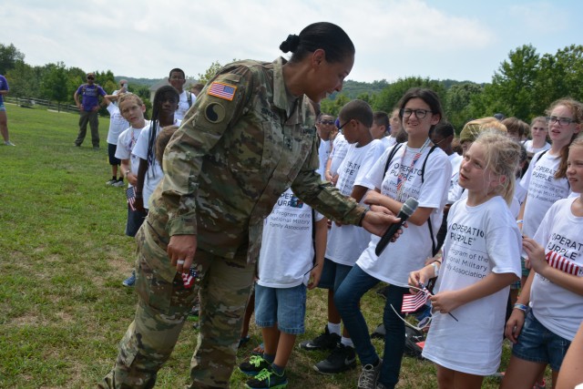 Soldiers, Army civilians break battle rhythm to support camp for military kids