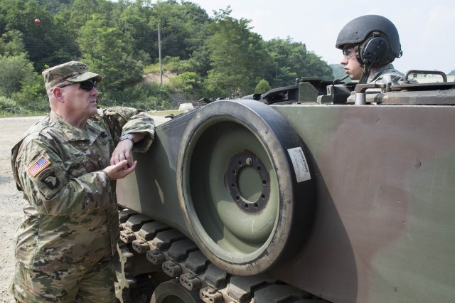 U.S. Army Chief of Staff, Gen. Mark A. Milley with a Soldier from the 2nd Infantry Division
