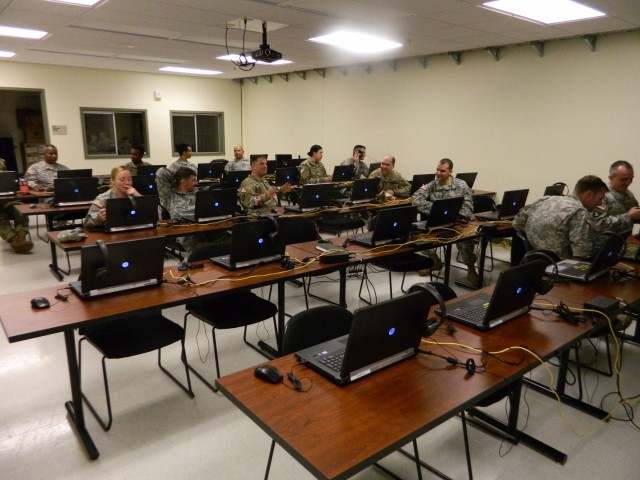 301st MEB HHC soldiers recieve a briefing on the Virtual Battlespace 3 system