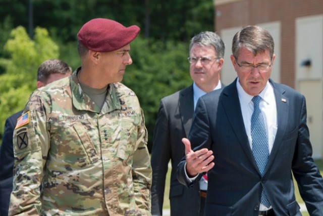 Defense Secretary Ash Carter speaks with Army Lt. Gen. Stephen J. Townsend