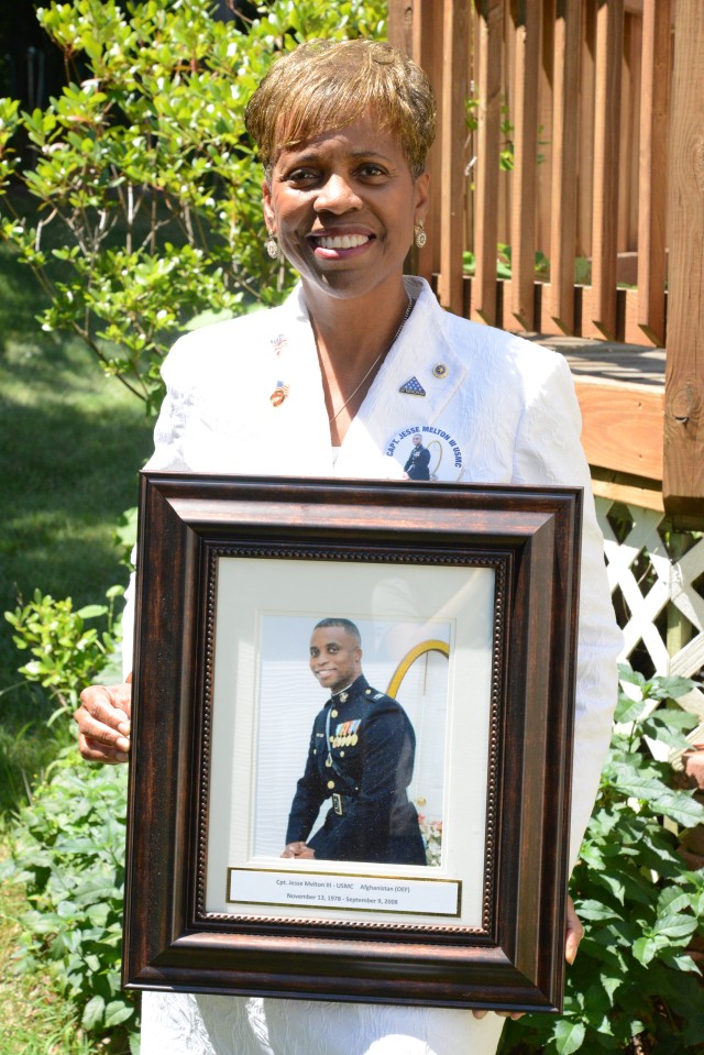 Gold Star mother Janice Chance holds framed photo of son
