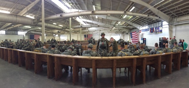Members of the 82nd Airborne waiting to board