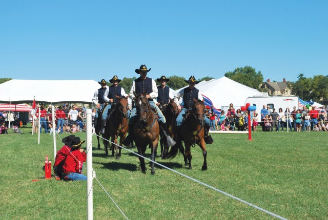 The 1st Infantry Division Commanding General's Mounted Color Guard impresses festival patrons.