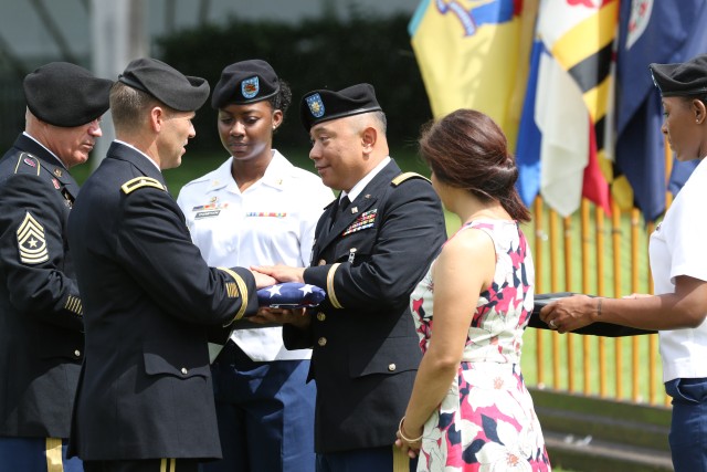 Maj. Michael Dizon receives retirement flag