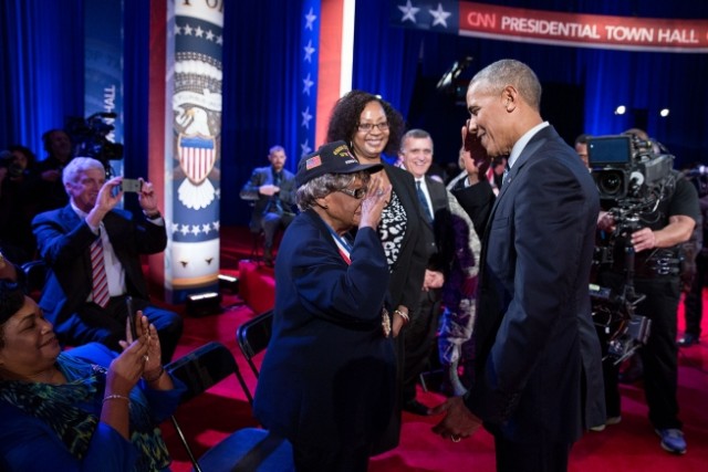 President Barack Obama returns a salute