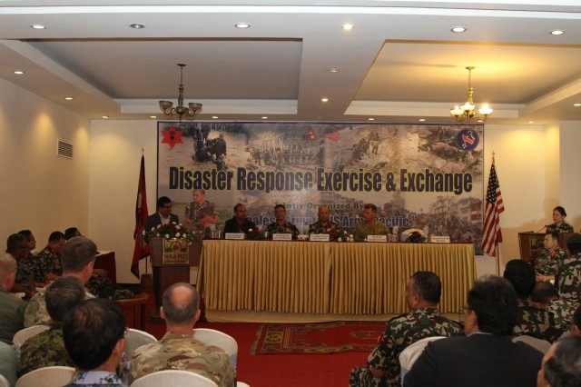 Kul Prasad Chudal, Nepal joint secretary ministry of defense (left), offers his concluding remarks during the disaster relief exchange exercise (DREE) in Kathmandu, Nepal, Sept. 22, 2016