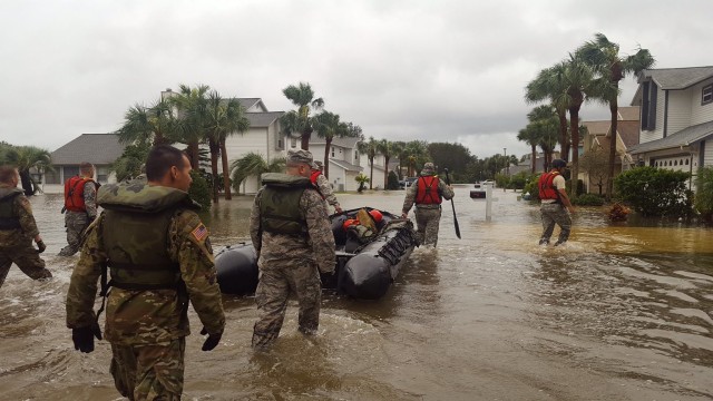 Guard members carry out search and rescue, as Hurricane Matthew batters Southeast coast