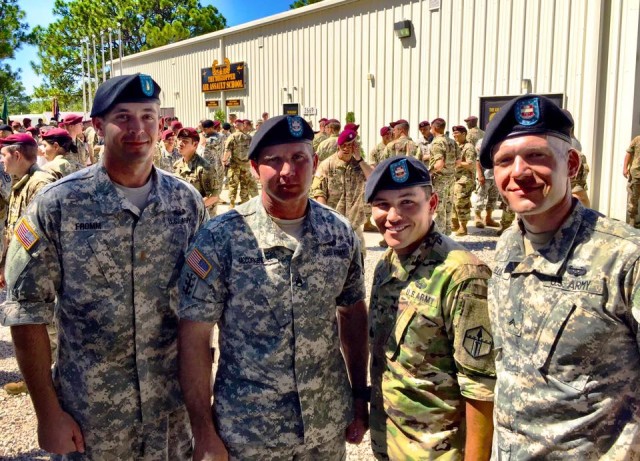 Spc. Orozco poses for a photograph with members of his unit after completing the DeGlopper Air Assault School at Fort Bragg