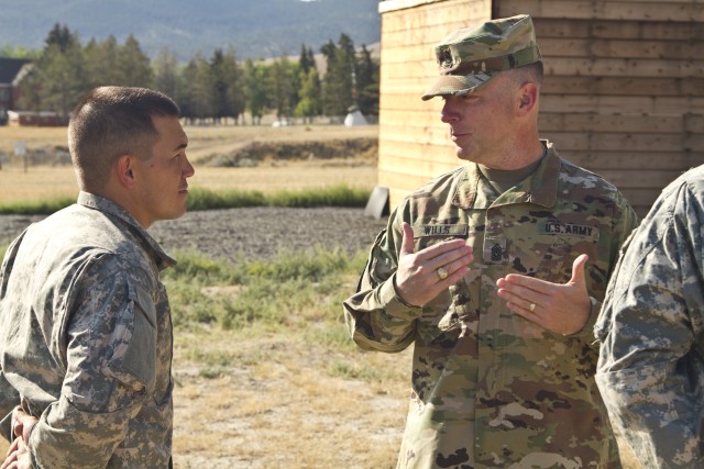USARC Command Sgt. Maj. James P. Wills speaks with Spc. Michael S. Orozco