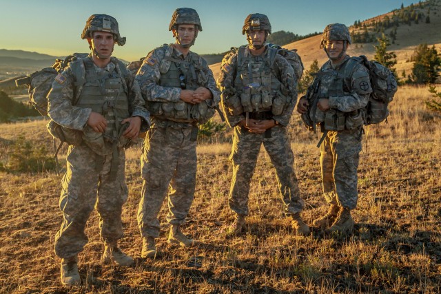 Army Reserve Best Warrior winners and runner-ups pause for a quick break during their eight mile foot march at Fort Harrison, Mont.