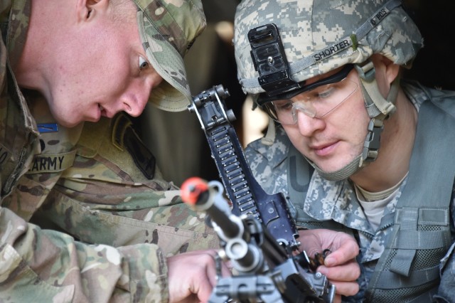 173rd paratrooper gives instructions during Expert Infatry Badge