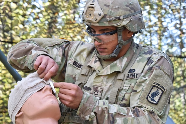 A 173rd paratrooper conducts fight aid procedures during EIB training