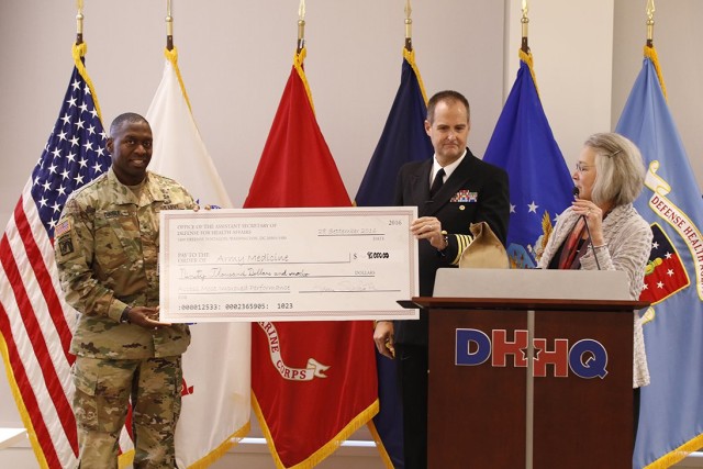 Brig. Gen. R. Scott Dingle recieves 90k check for access to care award