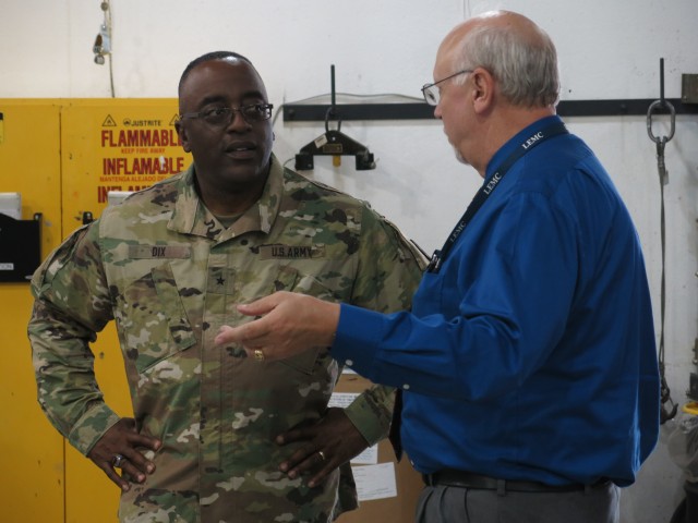 Brig. Gen. Richard Dix, Commanding General of Joint Munitions Command speaks with Mr. Ed Averill, Deputy to the Commander of Letterkenny Munitions Center, during his tour of operations vital to Army R