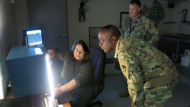 Letterkenny Munitions Center employee, Ms. Lisa Michael, demonstrates X-Ray capabilities to Brig. Gen. Richard Dix, Commanding General of Joint Munitions Command during his visit.