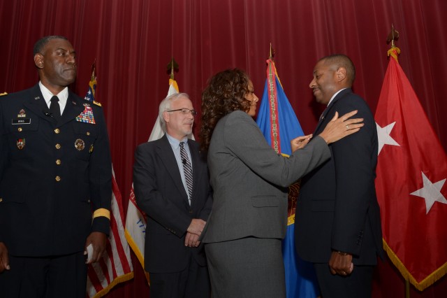 Eric Moore, Ph.D., pinned as a SES