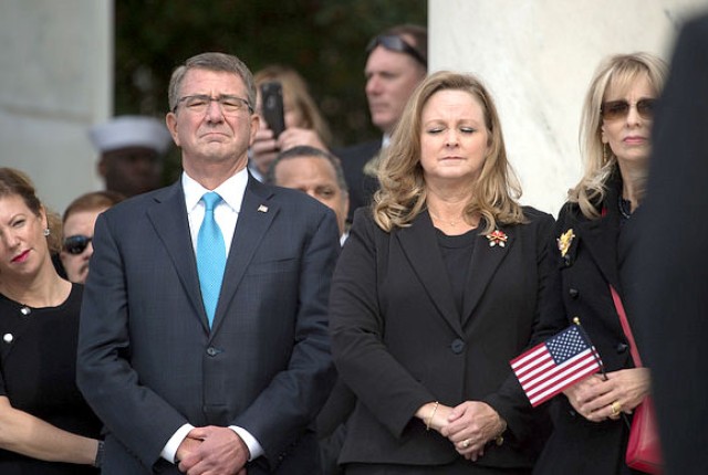 Secretary of Defense Ash Carter observes a moment of silence during Veterans Day