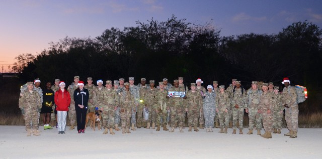 Headquarters Company, 13th Expeditionary Sustainment Command Bring's Toys to Santa's Worksop