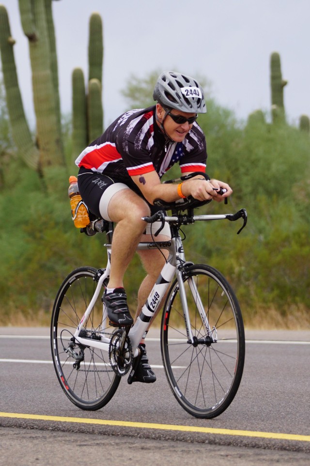 1st Sgt. Mitter completes the bicycle portion of the Ironman.