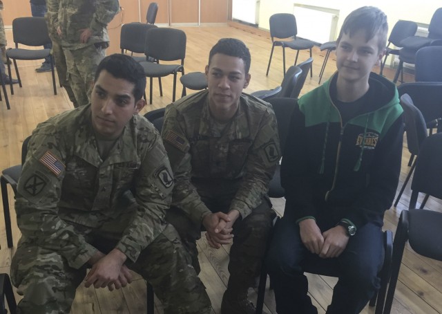 'Sky Soldiers' break from training to spend the afternoon with Latvian students