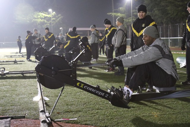 Senior Leaders participate in the Physical Readiness Training, getting ready to exercise on a rower at Camp Walker Kelley Field. 