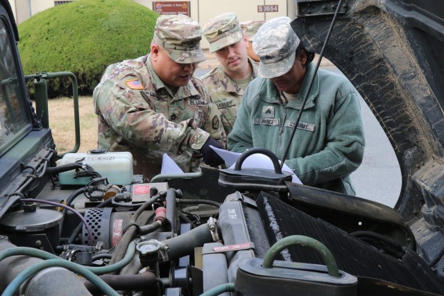 Under the 19th ESC instructors' guidance, junior Leaders demonstrate the process of a Preventive Maintenance Checks and Services with a 19th ESC Humvee at Camp Henry during the PMCS certification clas