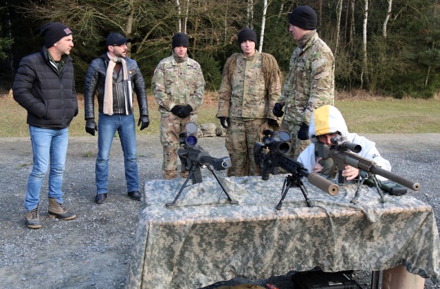 Soldiers teach music star different weapon systems