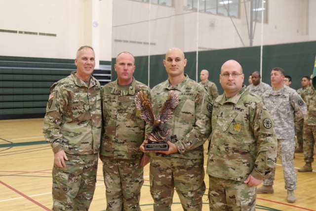 Brig. Gen. David P. Glaser, Commander, U.S. Army Corrections Command, poses for a group photo with United States Army Correctional Activity-Korea leadership Capt. Derick M. Hoy, Sgt. Maj. Justin E. Sh