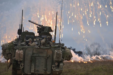Soldiers attack simulated enemy combatants, Feb. 2, 2016, while conducting a defense operation during exercise Allied Spirit IV at the U.S. Army's Joint Multinational Readiness Center in Hohenfels Training Area, Germany. They are attached to Fox Troo...