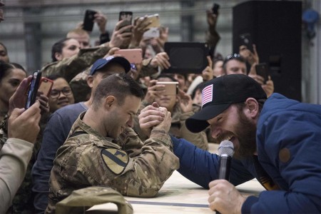 Scarlett Johansson and Chris Evans perform for service members during the USO Holiday Tour at Bagram Air Base, Afghanistan, Dec. 7, 2016. Marine Gen. Joseph F. Dunford Jr., chairman of the Joint Chiefs of Staff, along with USO entertainers, visited service members who are deployed from home during the holidays at various locations across the globe.  This year&#39;s entertainers included actors Chris Evans, actress Scarlett Johansson, NBA Legend Ray Allen, 4-time Olympic Medalist Maya DiRado, Country Music Singer Craig Campbell, and mentalist Jim Karol.