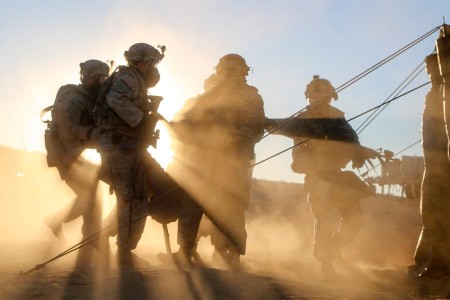 Soldiers carry a simulated casualty to a collection point during training at the National Training Center at Fort Irwin, Calif., Nov. 11, 2016.