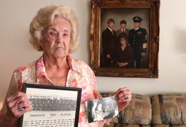 Willie McLaney holds a photo of the Airborne Test Platoon