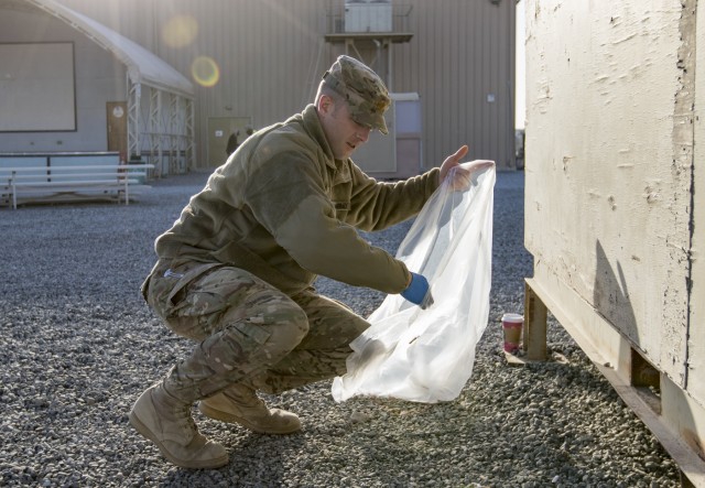 Deployed Soldiers Clean up Camp
