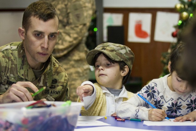 Soldiers visit with children at local shelter