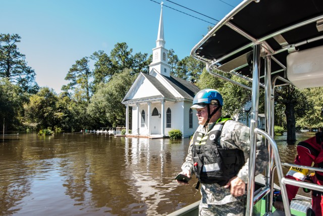 gt. Maj., surveys the flooded town of Nichols S.C.